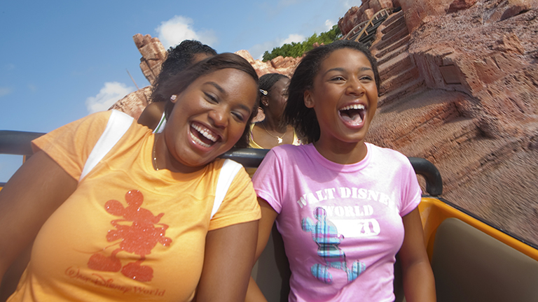 Teenage girls on Big Thunder Mountain Railroad in Magic Kingdom